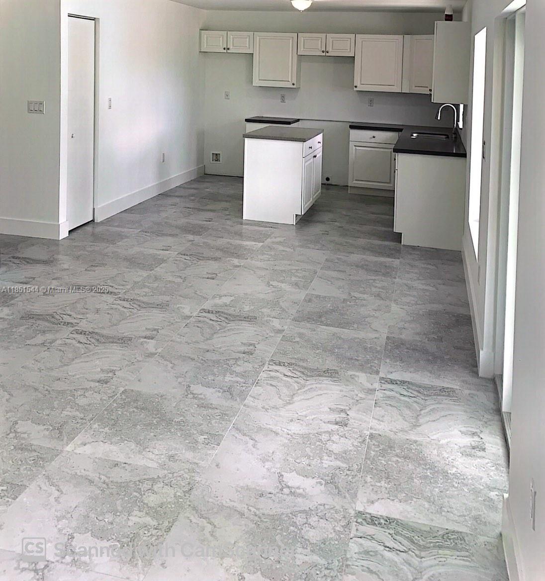 21872 Southwest 118th Avenue, Unit 2 Miami, FL 33170 - Photo 3 of 10 a room with a stove and a refrigerator