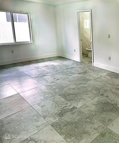 an empty room with a window