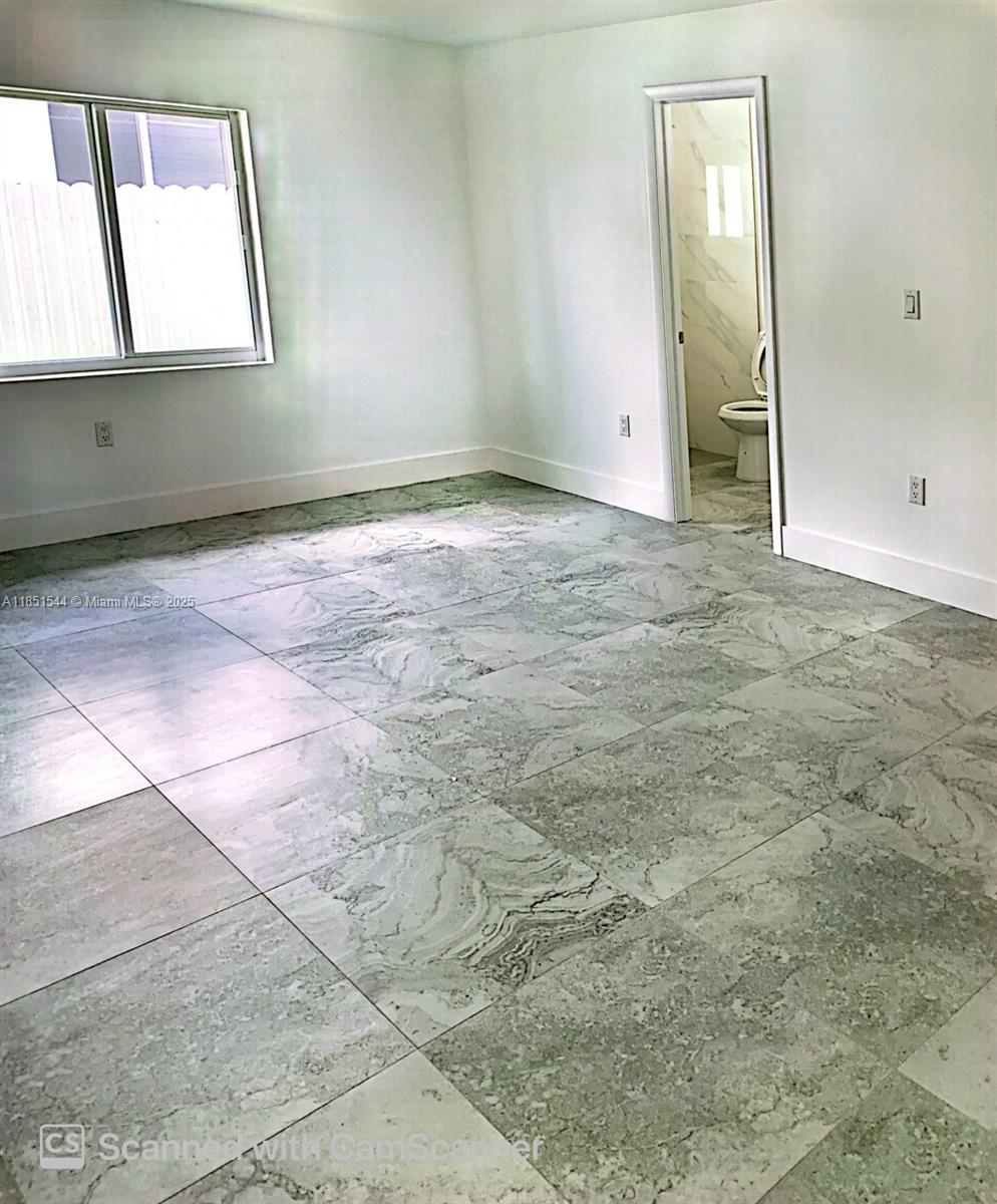 21872 Southwest 118th Avenue, Unit 2 Miami, FL 33170 - Photo 6 of 10 an empty room with windows