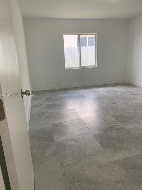 21872 Southwest 118th Avenue, Unit 2 Miami, FL 33170 - Photo 7 of 10 an empty room with a window