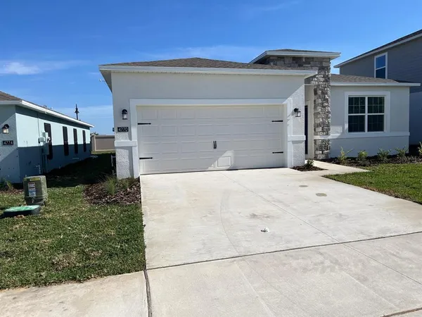 a view of a house with a small yard