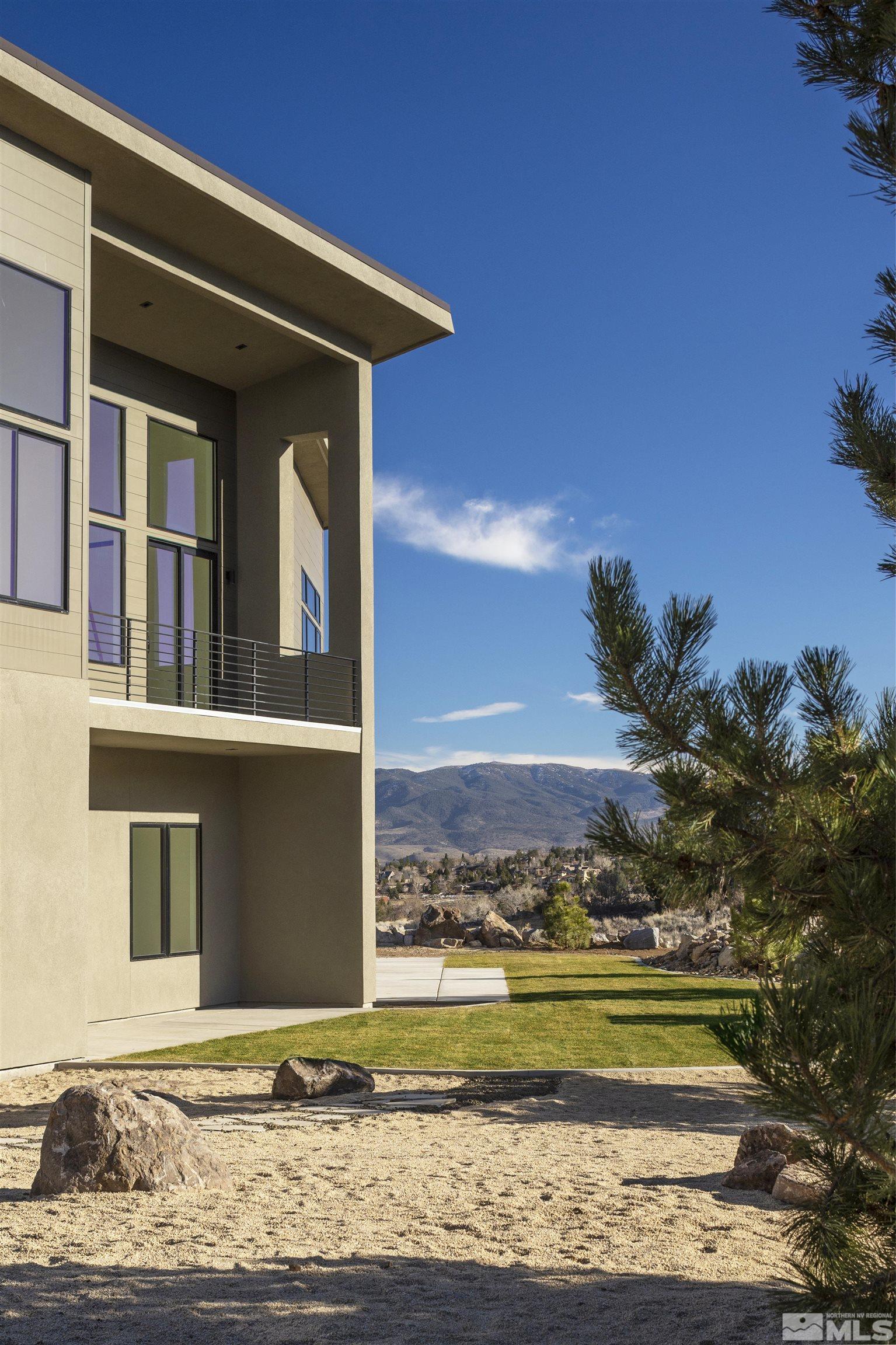 2331 Diamond J Place Reno, NV 89511 - Photo 16 of 25 a front view of a house with a yard