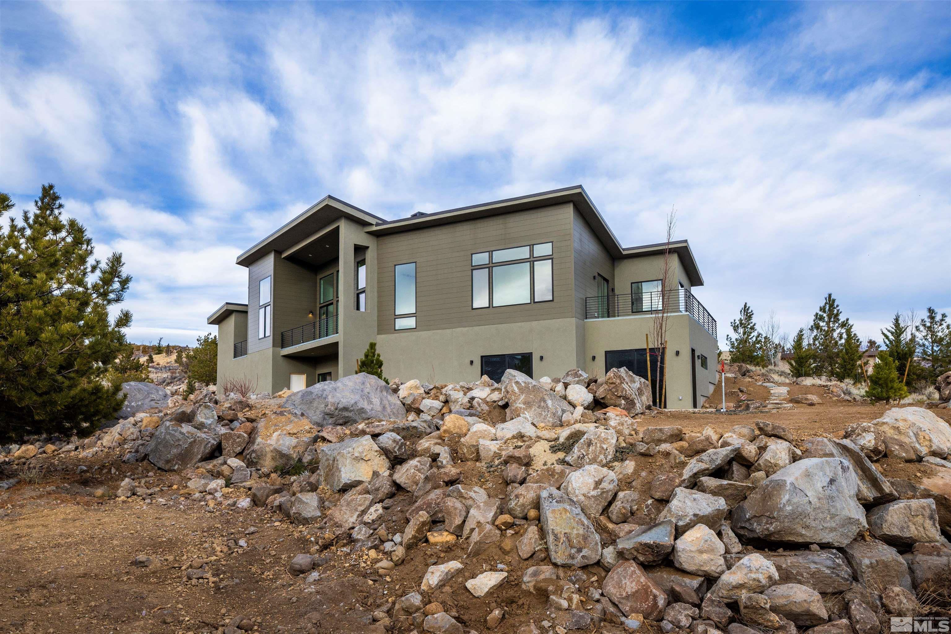 2331 Diamond J Place Reno, NV 89511 - Photo 18 of 25 a front view of a house with a yard