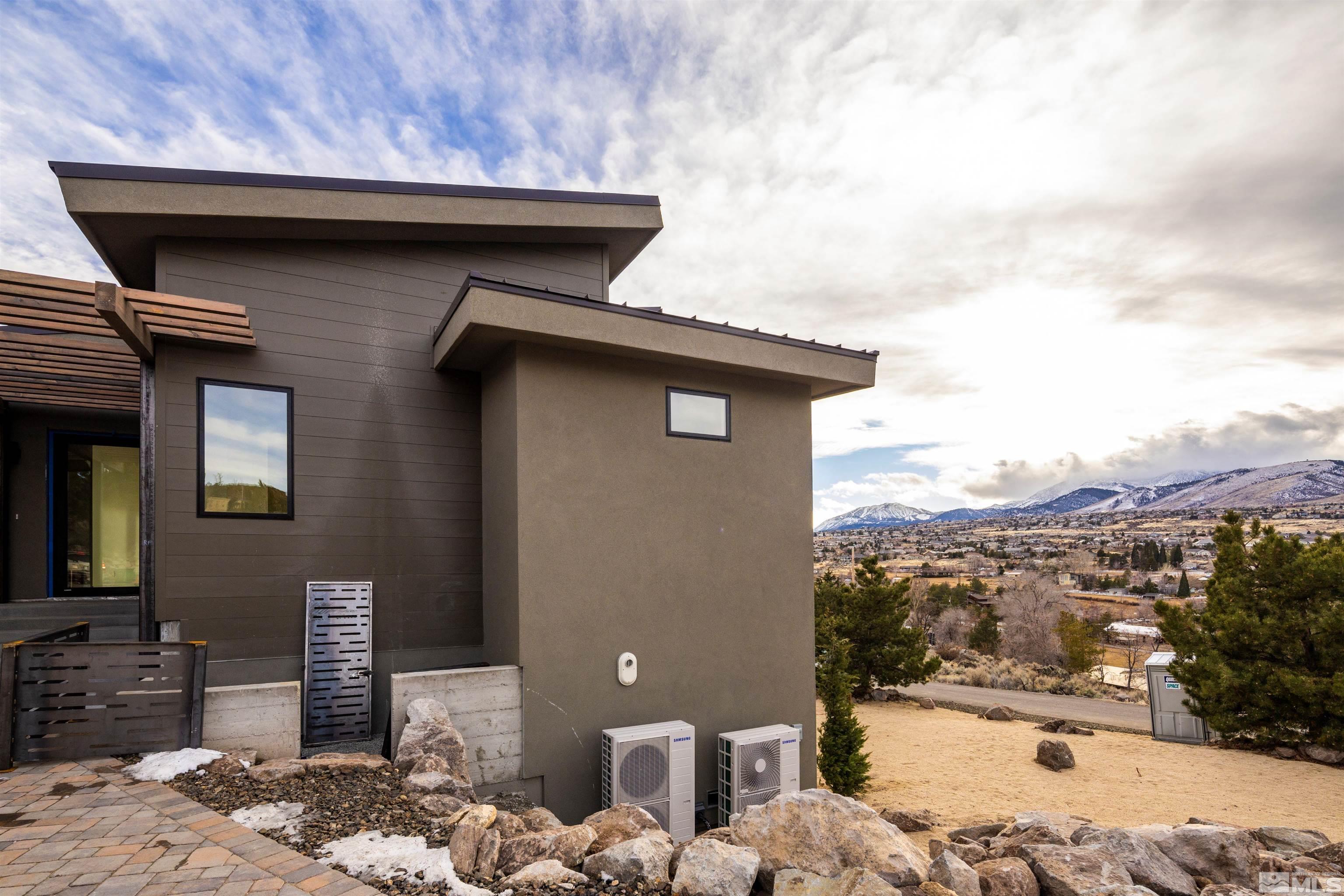 2331 Diamond J Place Reno, NV 89511 - Photo 19 of 25 a pathway of a house with a yard
