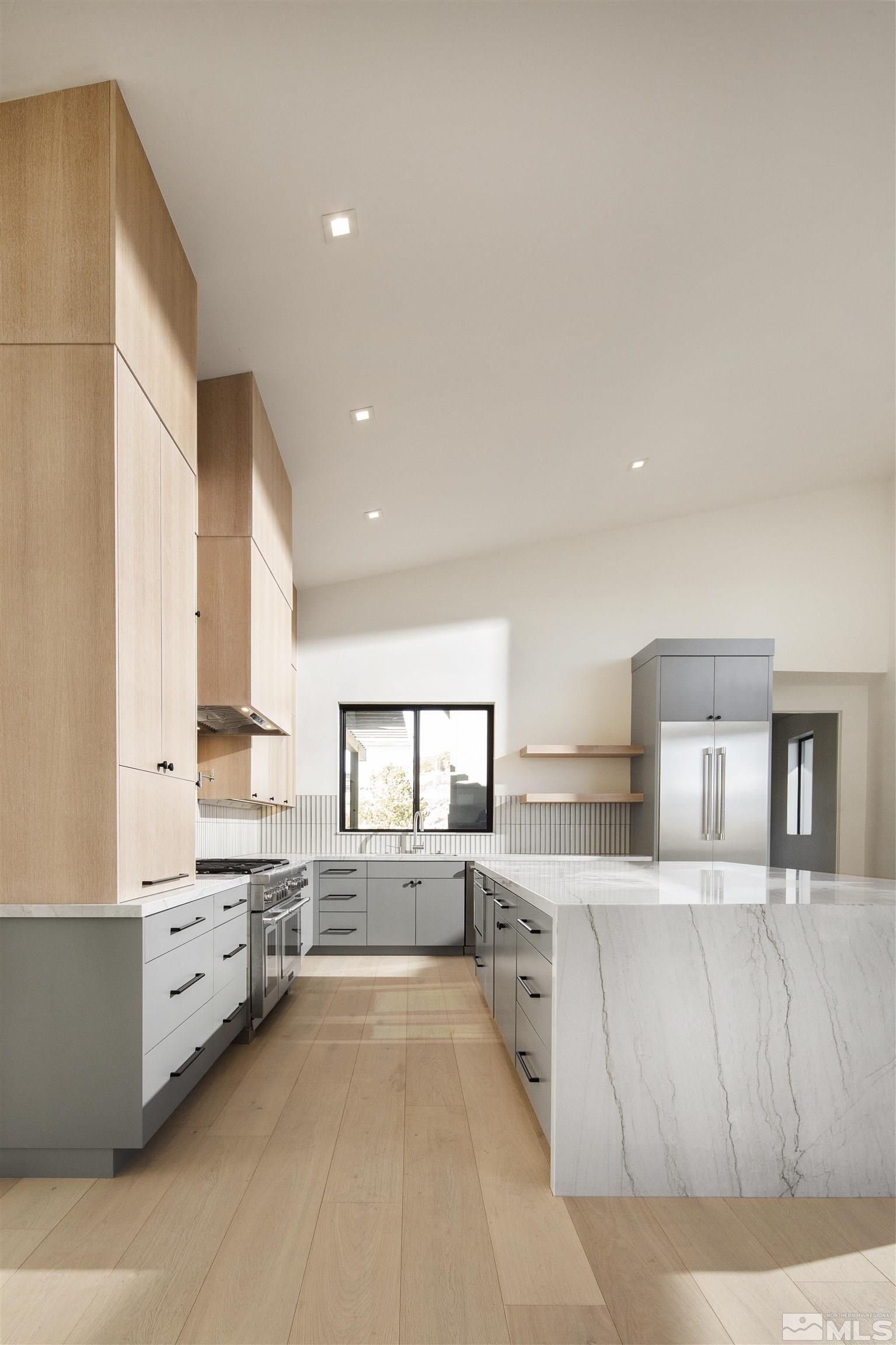2331 Diamond J Place Reno, NV 89511 - Photo 2 of 25 a large white kitchen with a large window