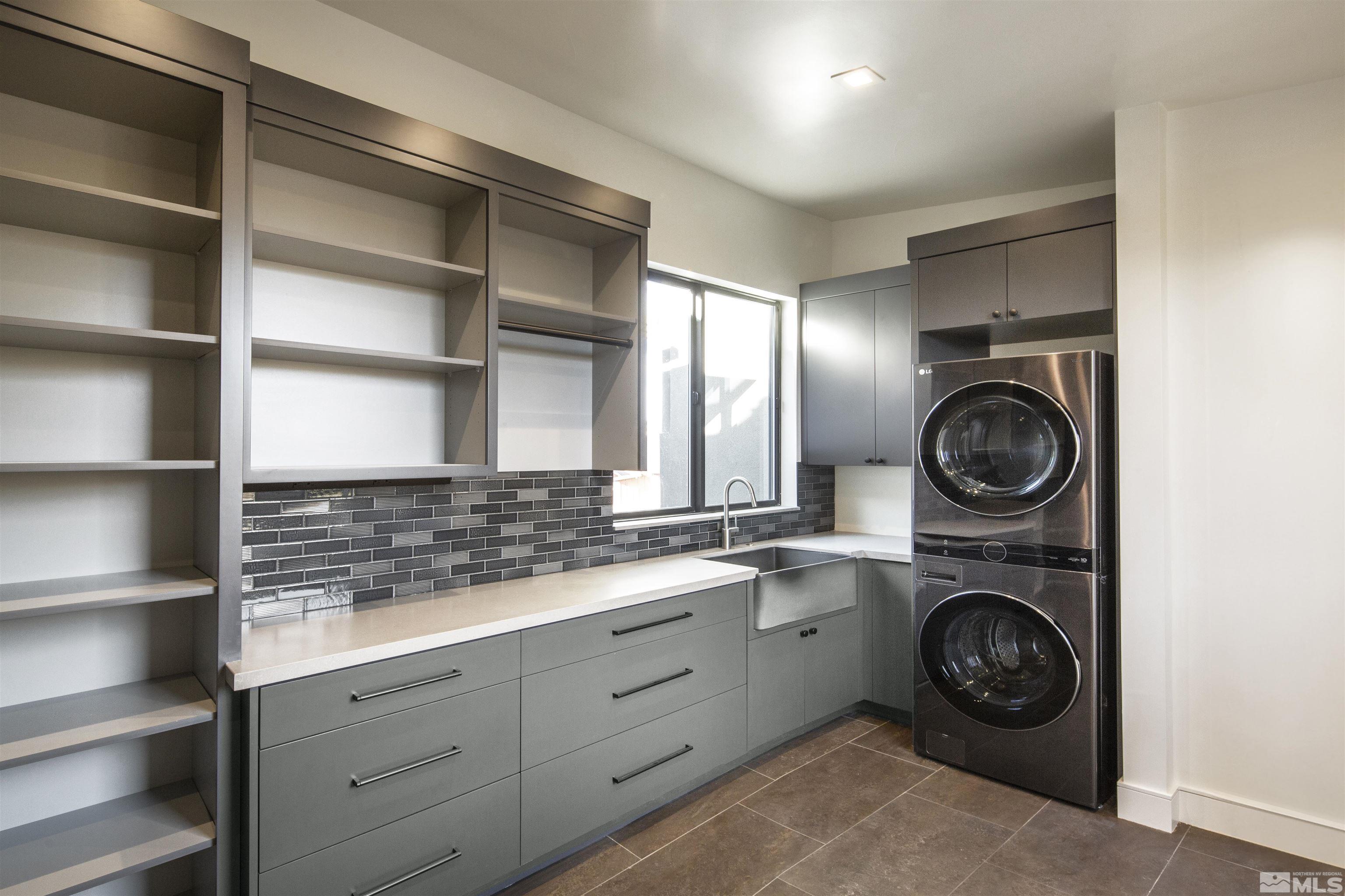 2331 Diamond J Place Reno, NV 89511 - Photo 5 of 25 a view of a storage and utility room with washer and dryer