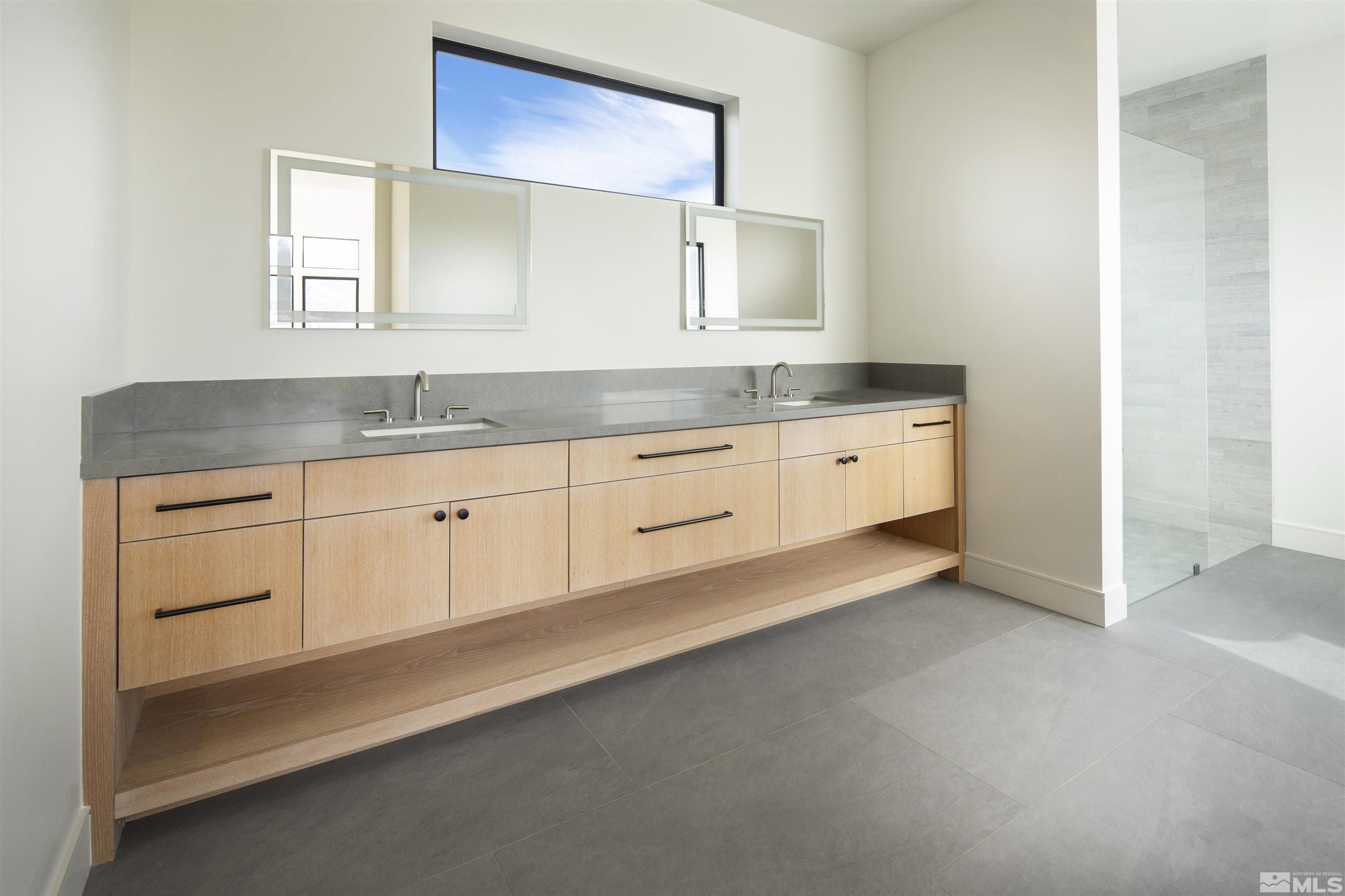2331 Diamond J Place Reno, NV 89511 - Photo 7 of 25 a spacious bathroom with a granite countertop sink and a mirror