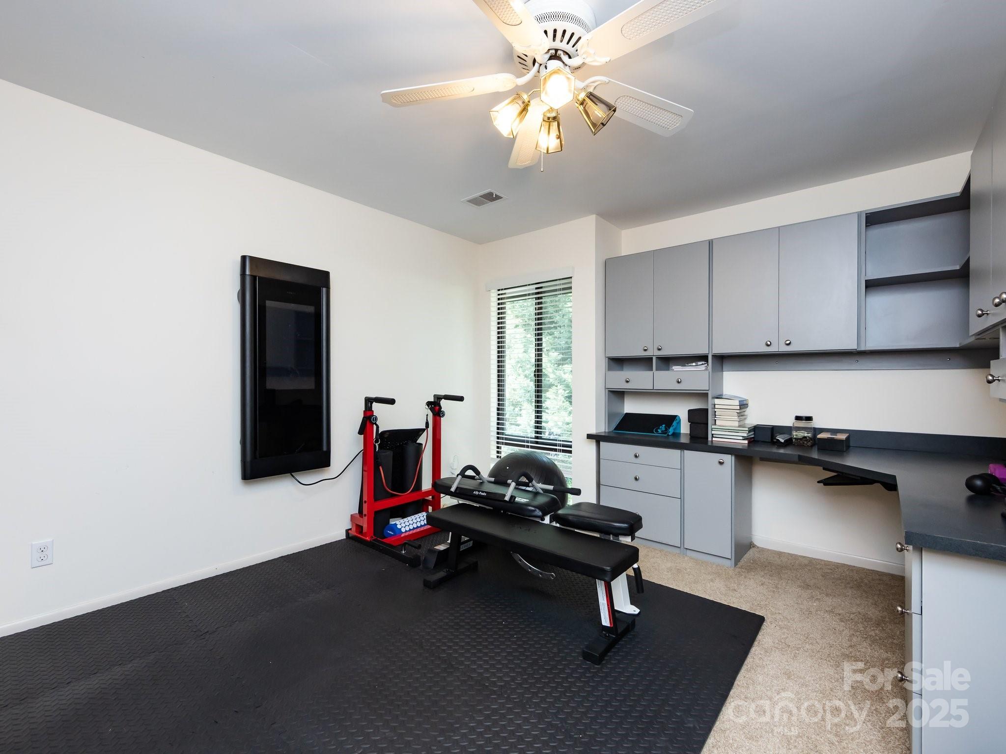 5809 Sharon Road, Unit G Charlotte, NC 28210 - Photo 18 of 25 a living room with furniture and a flat screen tv