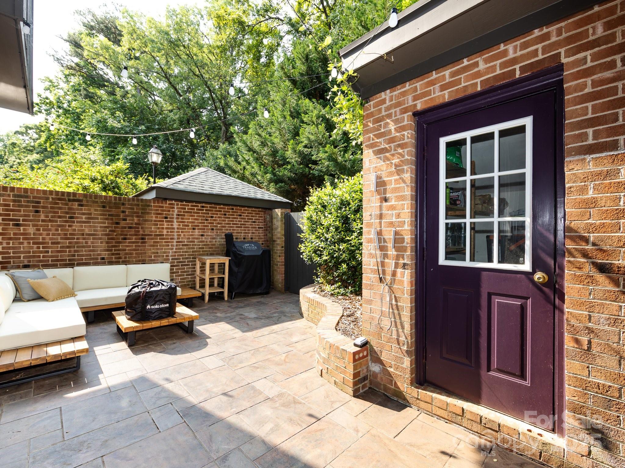 5809 Sharon Road, Unit G Charlotte, NC 28210 - Photo 19 of 25 a car parked in front of a house