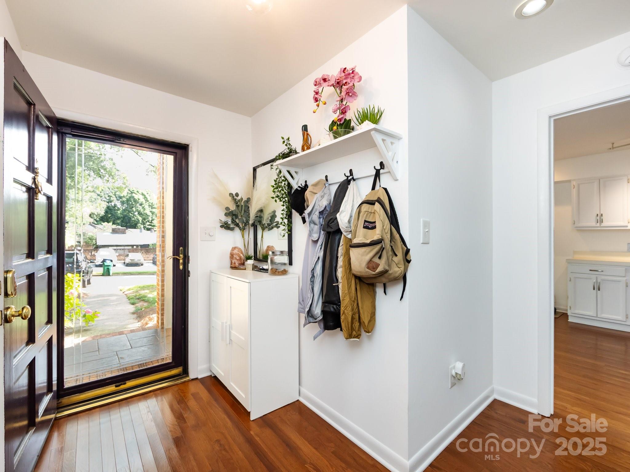 5809 Sharon Road, Unit G Charlotte, NC 28210 - Photo 2 of 25 a view of an entryway with wooden floor
