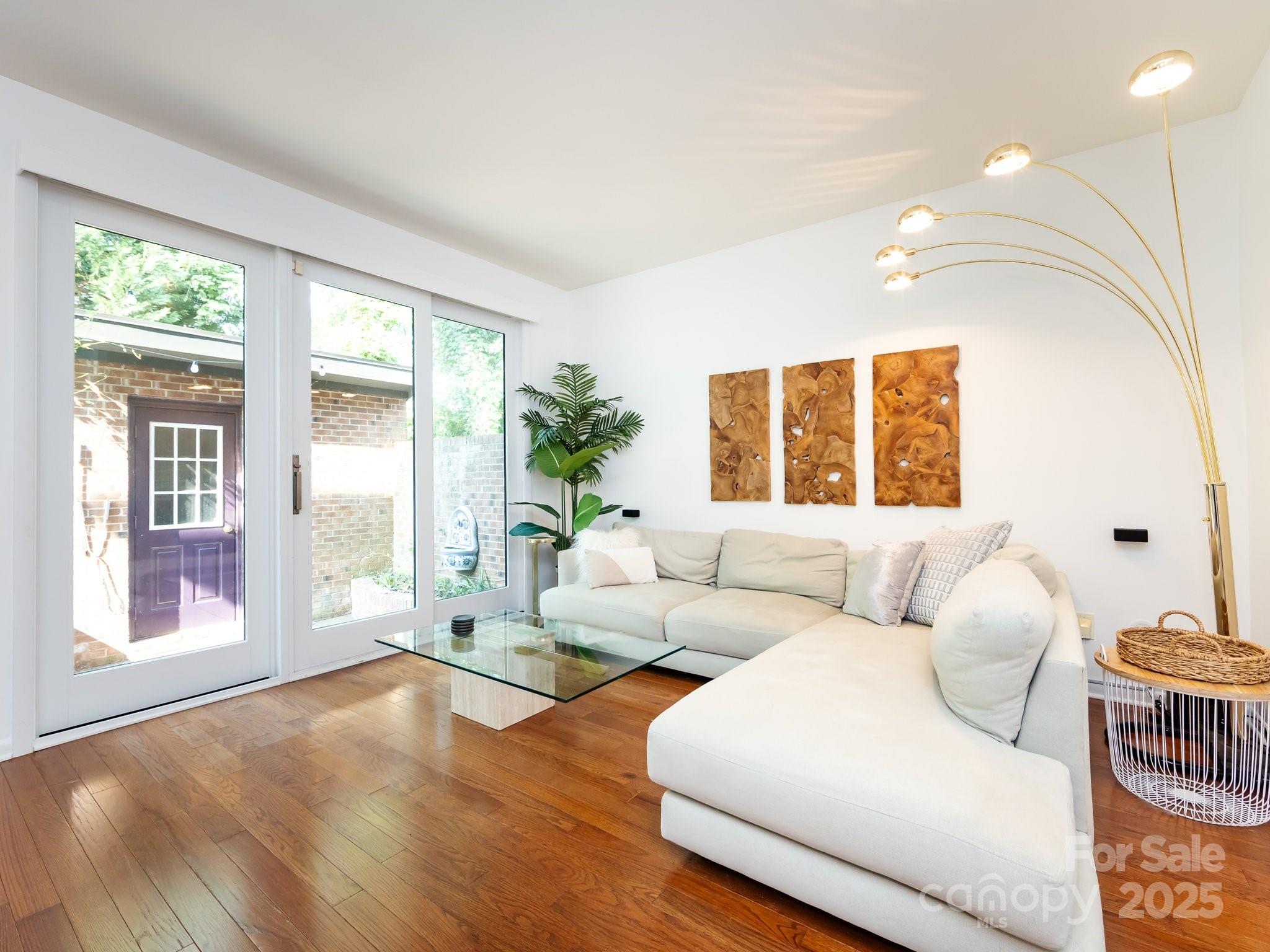 5809 Sharon Road, Unit G Charlotte, NC 28210 - Photo 9 of 25 a living room with furniture and a large window