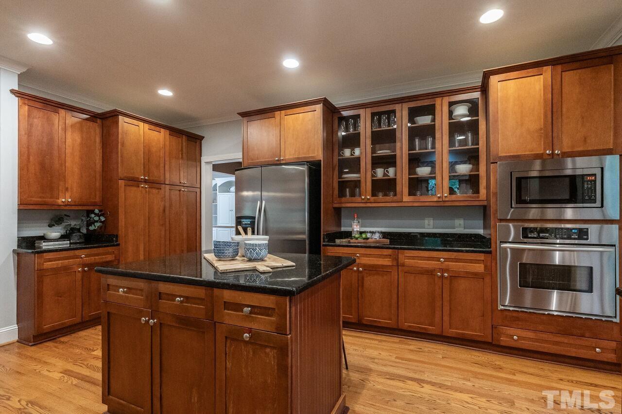 2730 Rothgeb Drive Raleigh, NC 27609 - Photo 20 of 43 a kitchen with stainless steel appliances granite countertop a stove a sink dishwasher a refrigerator and a microwave