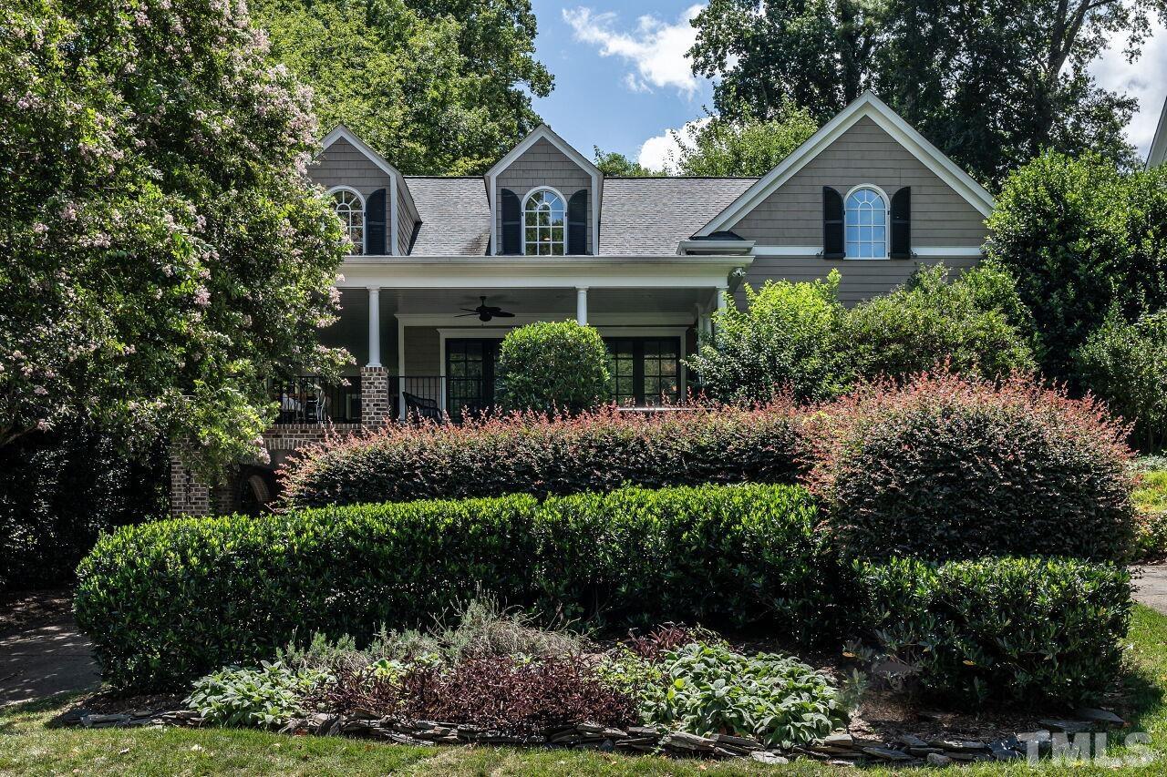 2730 Rothgeb Drive Raleigh, NC 27609 - Photo 2 of 43 a front view of a house with a yard and garage