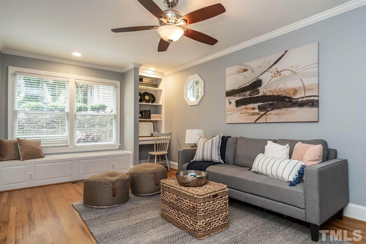 2730 Rothgeb Drive Raleigh, NC 27609 - Photo 24 of 43 a living room with furniture and a large window