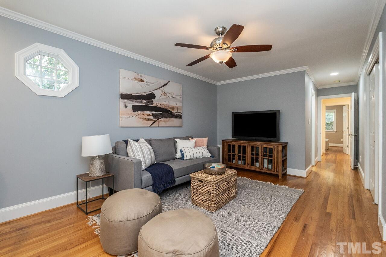 2730 Rothgeb Drive Raleigh, NC 27609 - Photo 25 of 43 a living room with furniture and a flat screen tv
