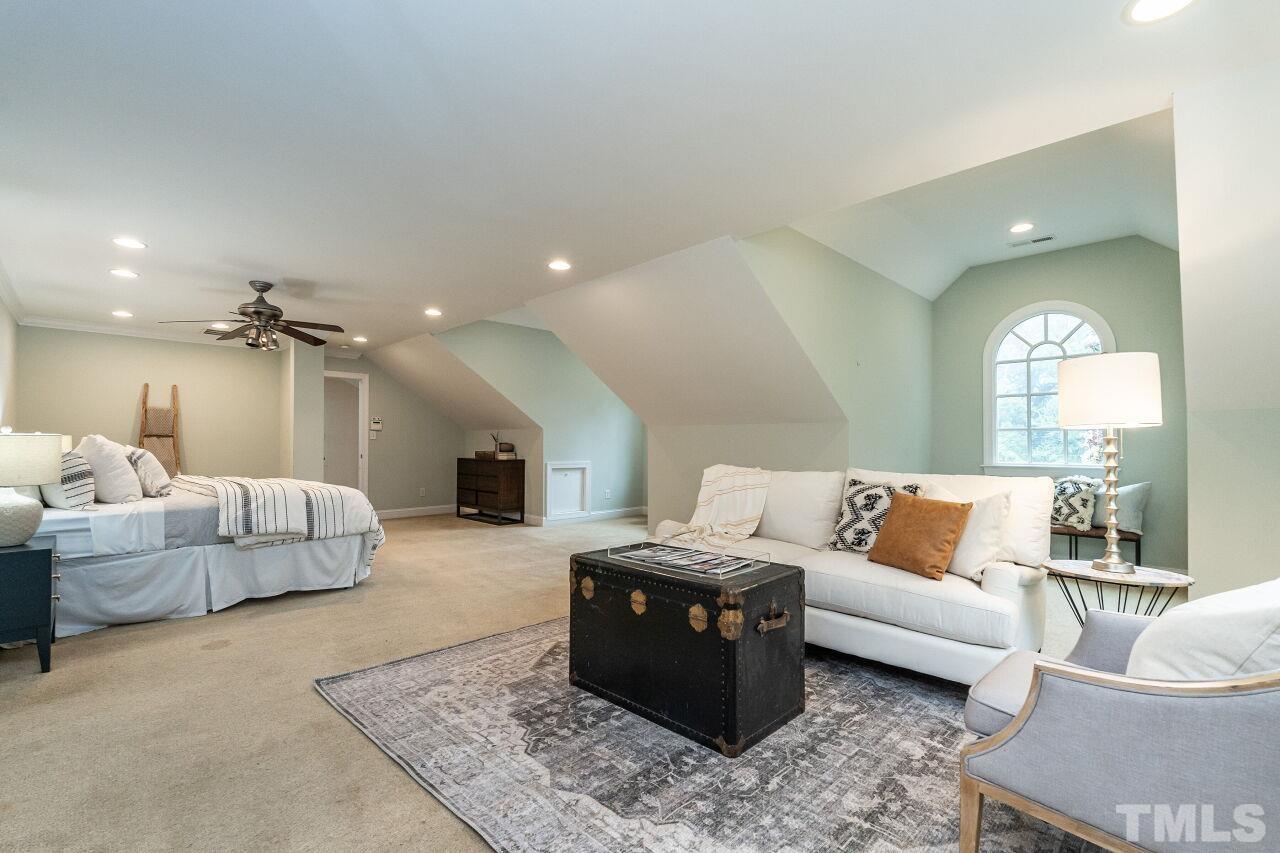 2730 Rothgeb Drive Raleigh, NC 27609 - Photo 29 of 43 a living room with furniture and a fireplace