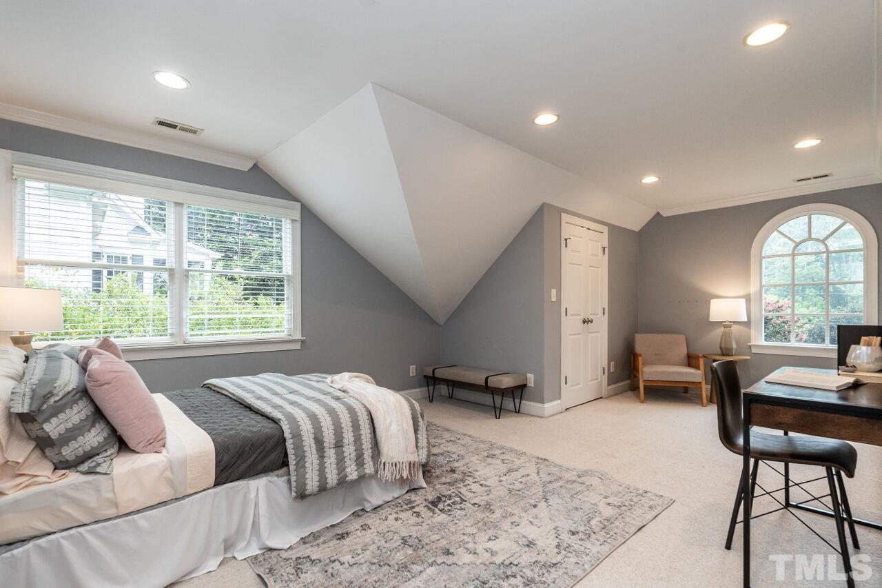 2730 Rothgeb Drive Raleigh, NC 27609 - Photo 34 of 43 a bed room with a bed and a large window