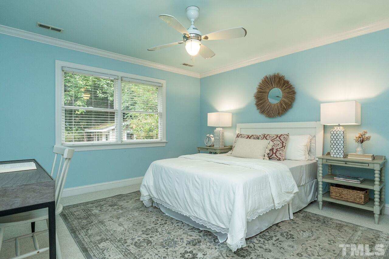 2730 Rothgeb Drive Raleigh, NC 27609 - Photo 35 of 43 a bedroom with a bed and a window