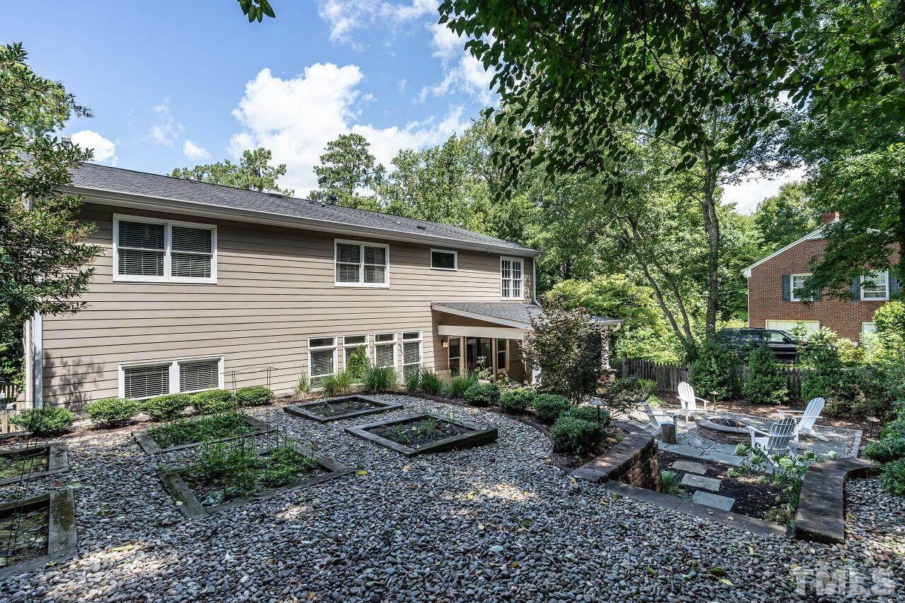 2730 Rothgeb Drive Raleigh, NC 27609 - Photo 43 of 43 a view of backyard with outdoor seating and green space