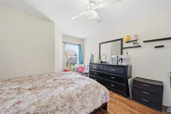 a bedroom with a bed and a dresser