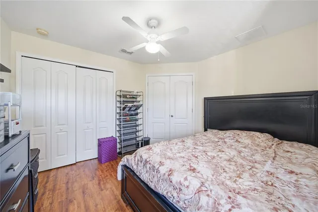 a bedroom with a bed and a cabinets