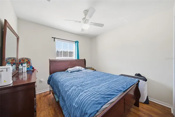 a bedroom with a bed and a dresser