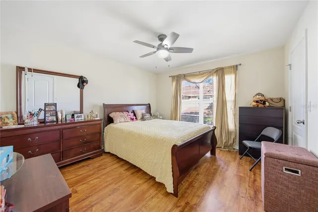 a bed room with a bed and a window