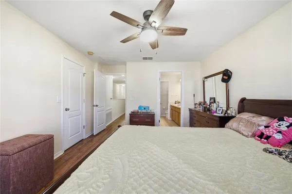 a bed room with a bed and a chandelier