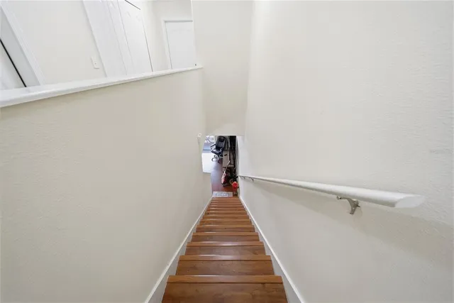 a view of a hallway with stairs