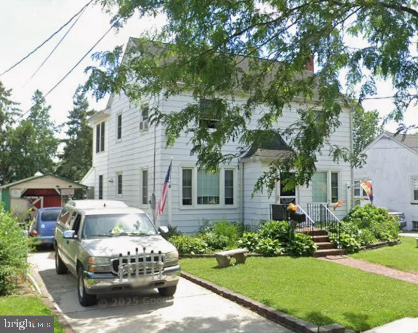2004 Sycamore Street Haddon Heights, NJ 08035 - Photo 2 of 7 a front view of a house with a garden