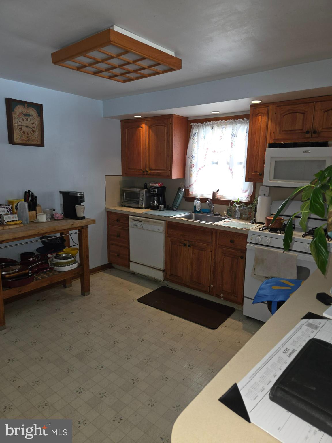 2004 Sycamore Street Haddon Heights, NJ 08035 - Photo 6 of 7 a kitchen with stainless steel appliances kitchen island granite countertop a sink and cabinets