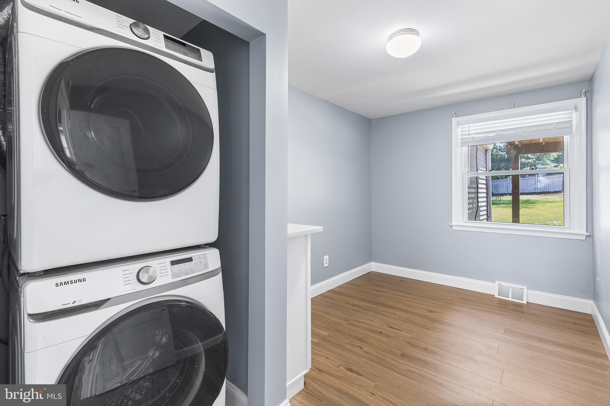 343 A Sugartown Road, Unit A Wayne, PA 19087 - Photo 6 of 11 a view of a hallway with washer and dryer
