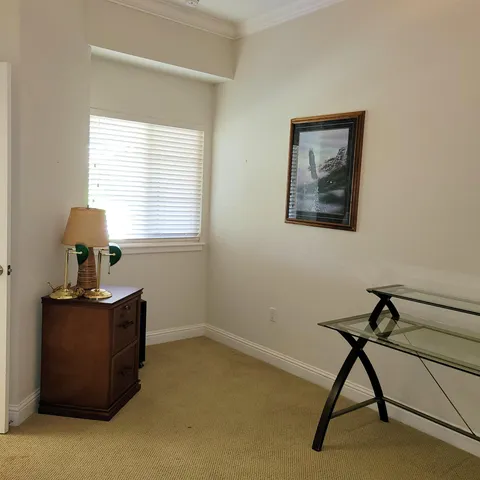 a view of a workspace with furniture