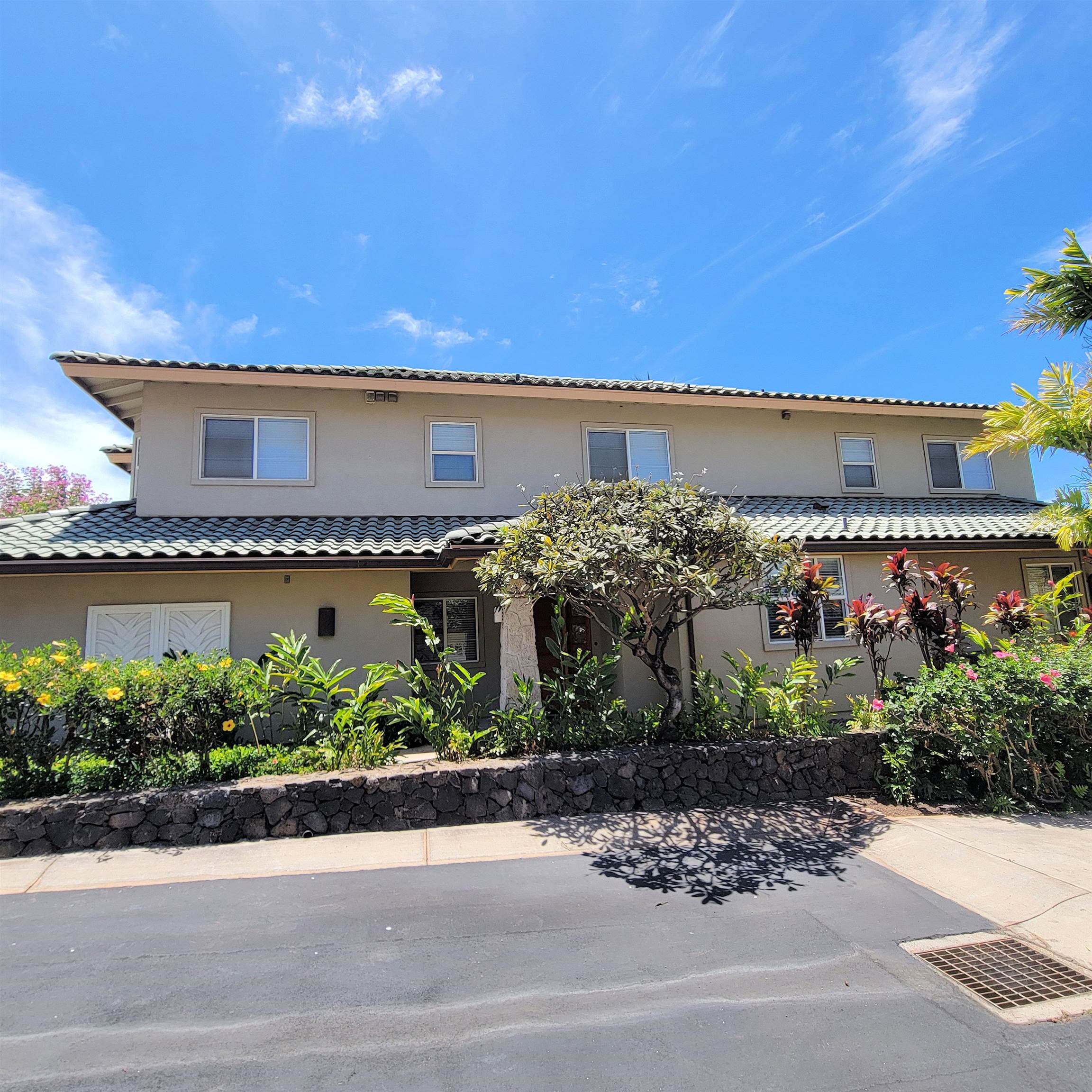 83 Kainehe Place, Unit 9B Kihei, HI 96753 - Photo 3 of 23 front view of a building with a street