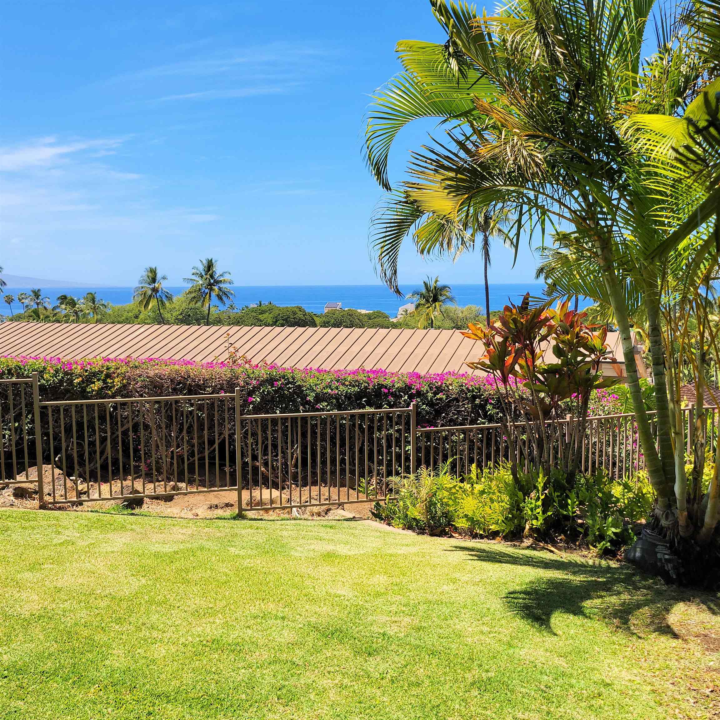 83 Kainehe Place, Unit 9B Kihei, HI 96753 - Photo 4 of 23 a swimming pool with outdoor seating and yard