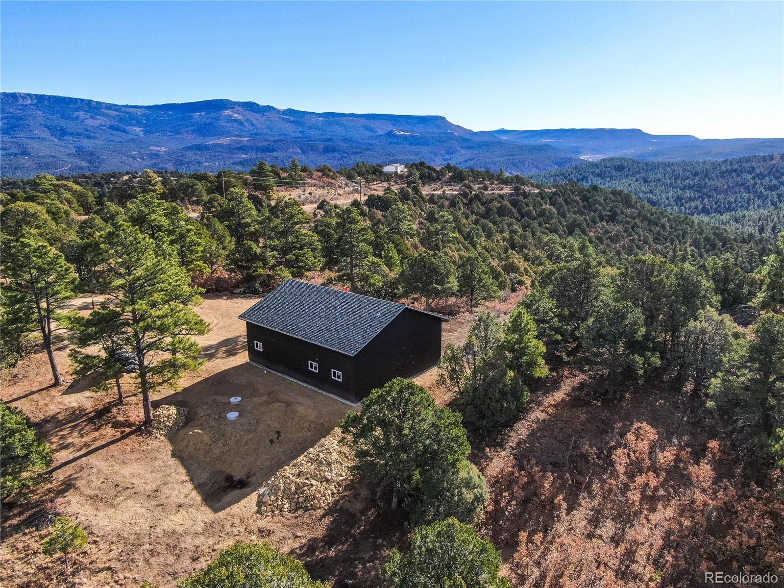 33191 Elk Park Road Trinidad, CO 81082 - Photo 26 of 33 a view of a lush green hillside and a houses