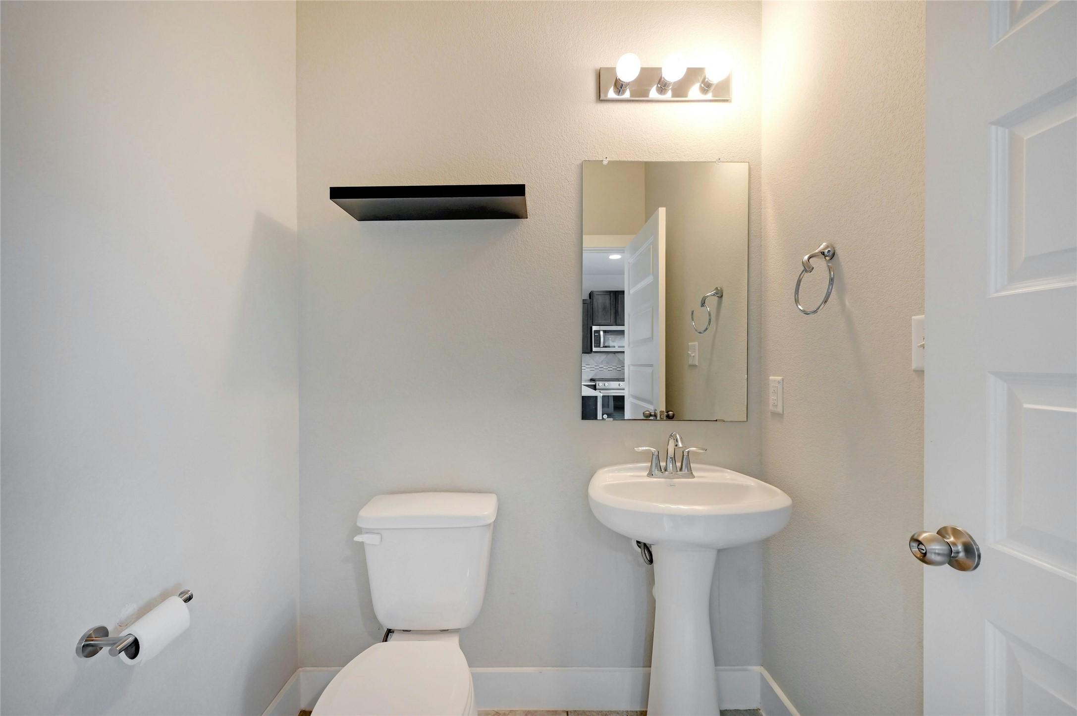 121 Switchgrass Street San Marcos, TX 78666 - Photo 17 of 33 Half bath downstairs just off the living room.