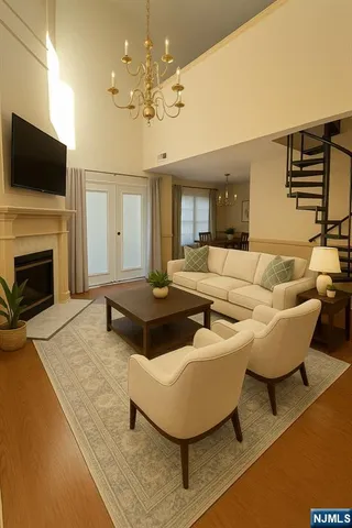 a view of a room with wooden floor and potted plant