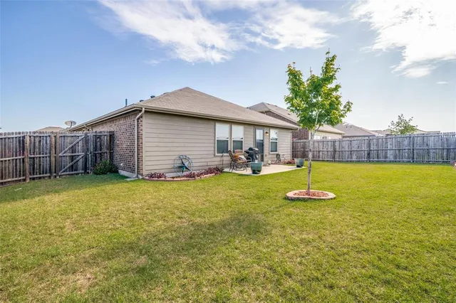 a backyard of a house with lots of green space