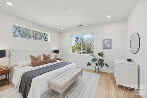 a bedroom with bed and a window