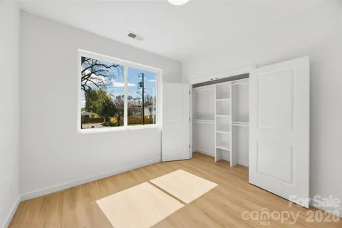 a view of an empty room with glass door