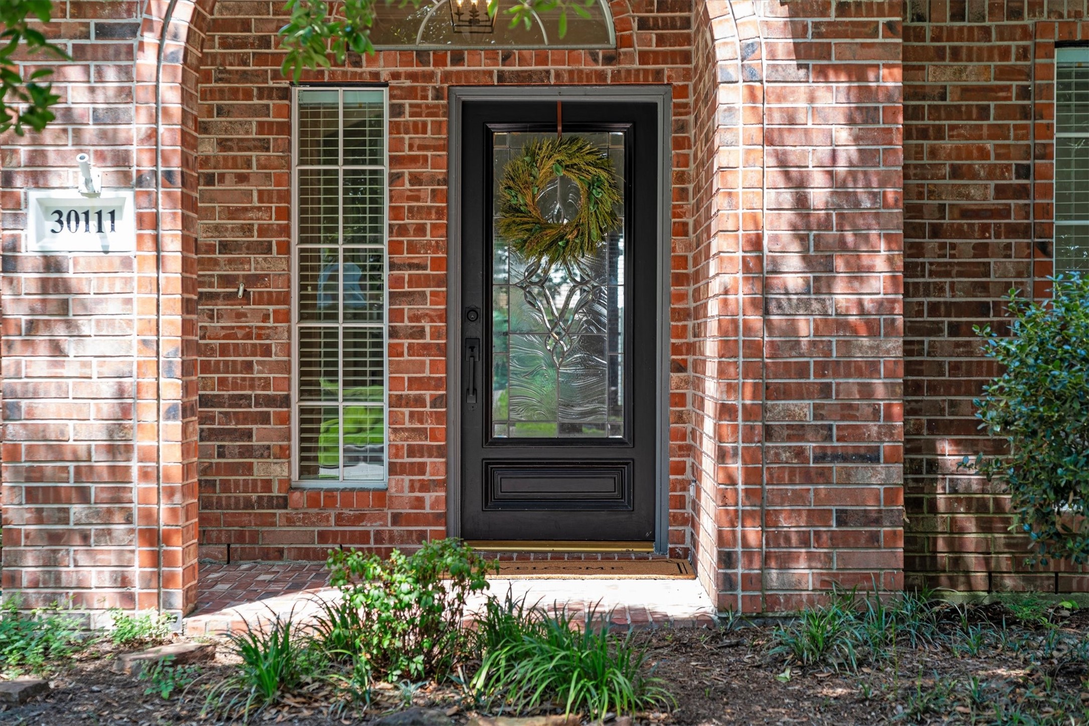 30111 Granum Drive Spring, TX 77386 - Photo 2 of 45 a front view of a house with a garden