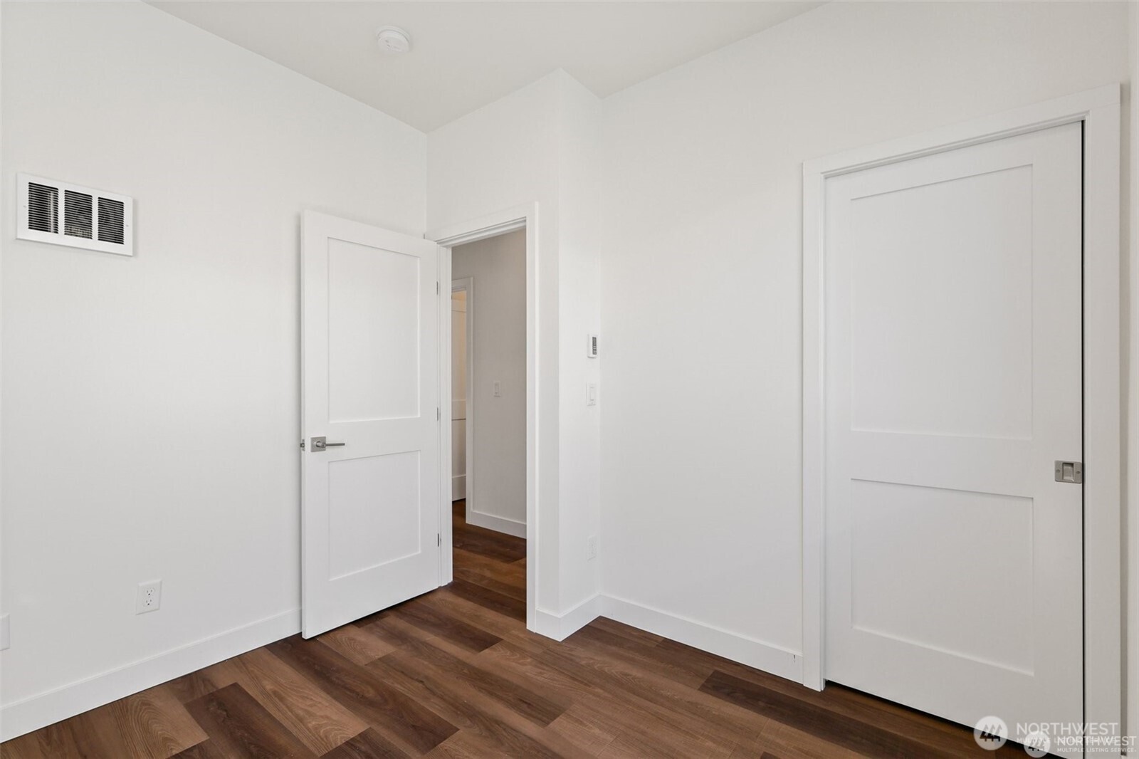 5259 Brooklyn Avenue Northeast Seattle, WA 98105 - Photo 20 of 40 a view of an empty room with wooden floor
