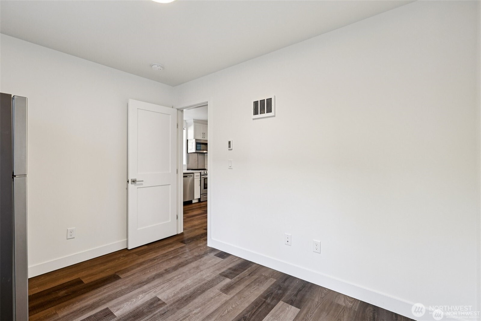 5259 Brooklyn Avenue Northeast Seattle, WA 98105 - Photo 10 of 40 a view of an empty room with wooden floor