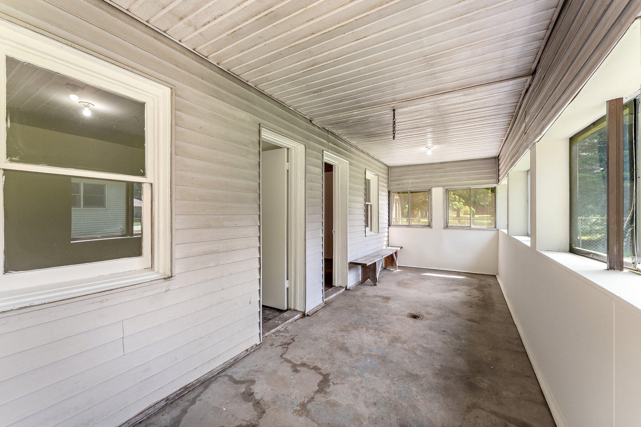 402 Alice Street Kouts, IN 46347 - Photo 19 of 21 a view of empty room with large windows