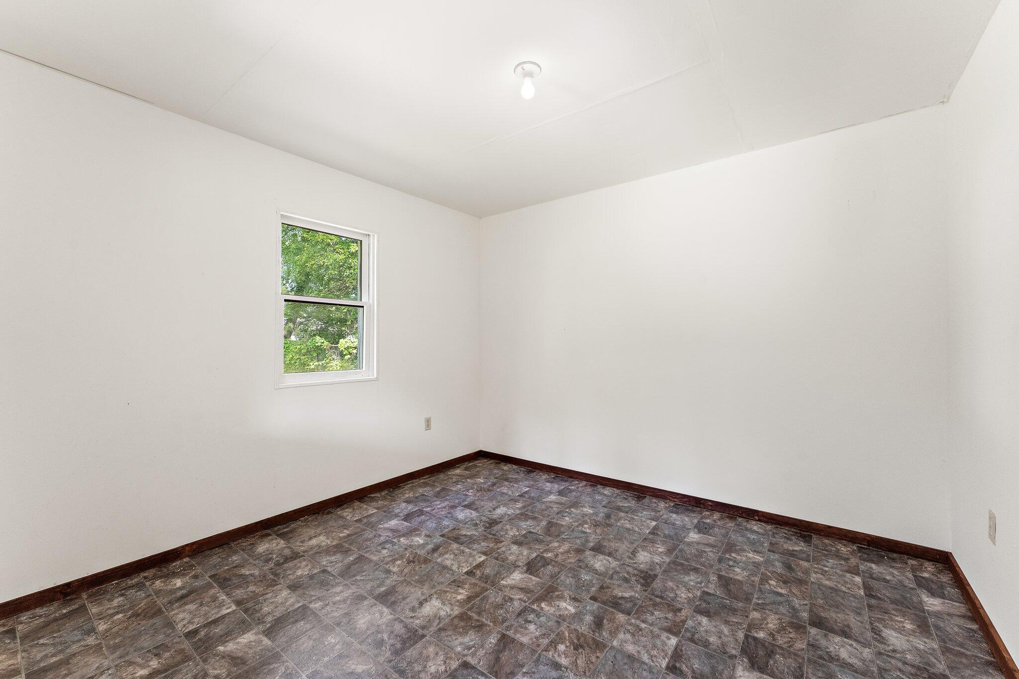402 Alice Street Kouts, IN 46347 - Photo 20 of 21 an empty room with a window