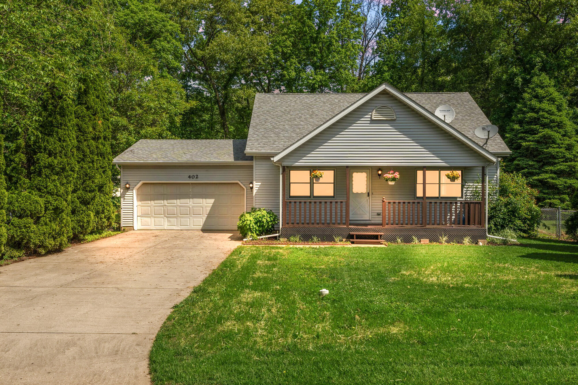 402 Alice Street Kouts, IN 46347 - Photo 2 of 21 a front view of a house with yard and green space