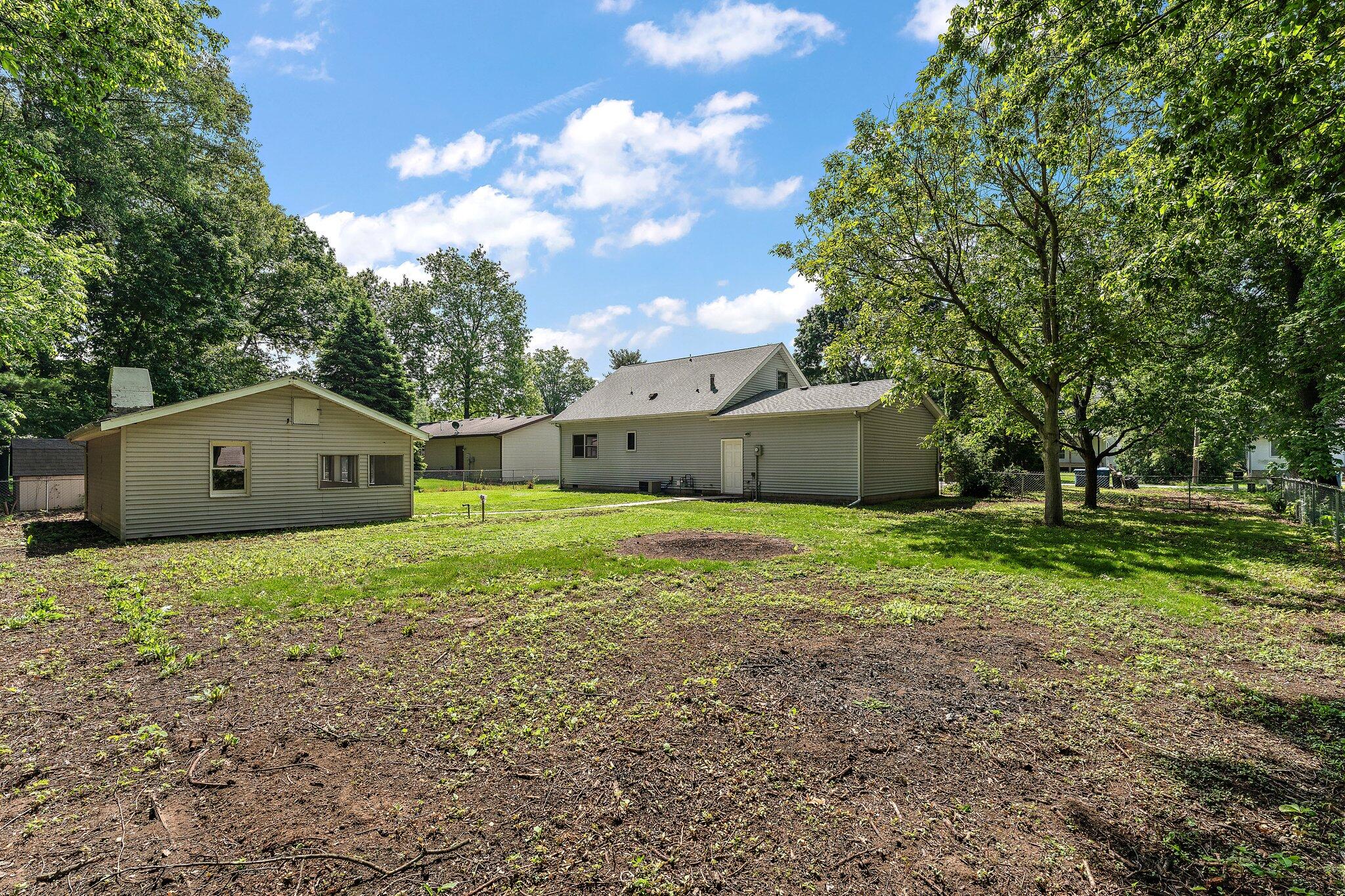 402 Alice Street Kouts, IN 46347 - Photo 21 of 21 a view of a house with yard and a tree