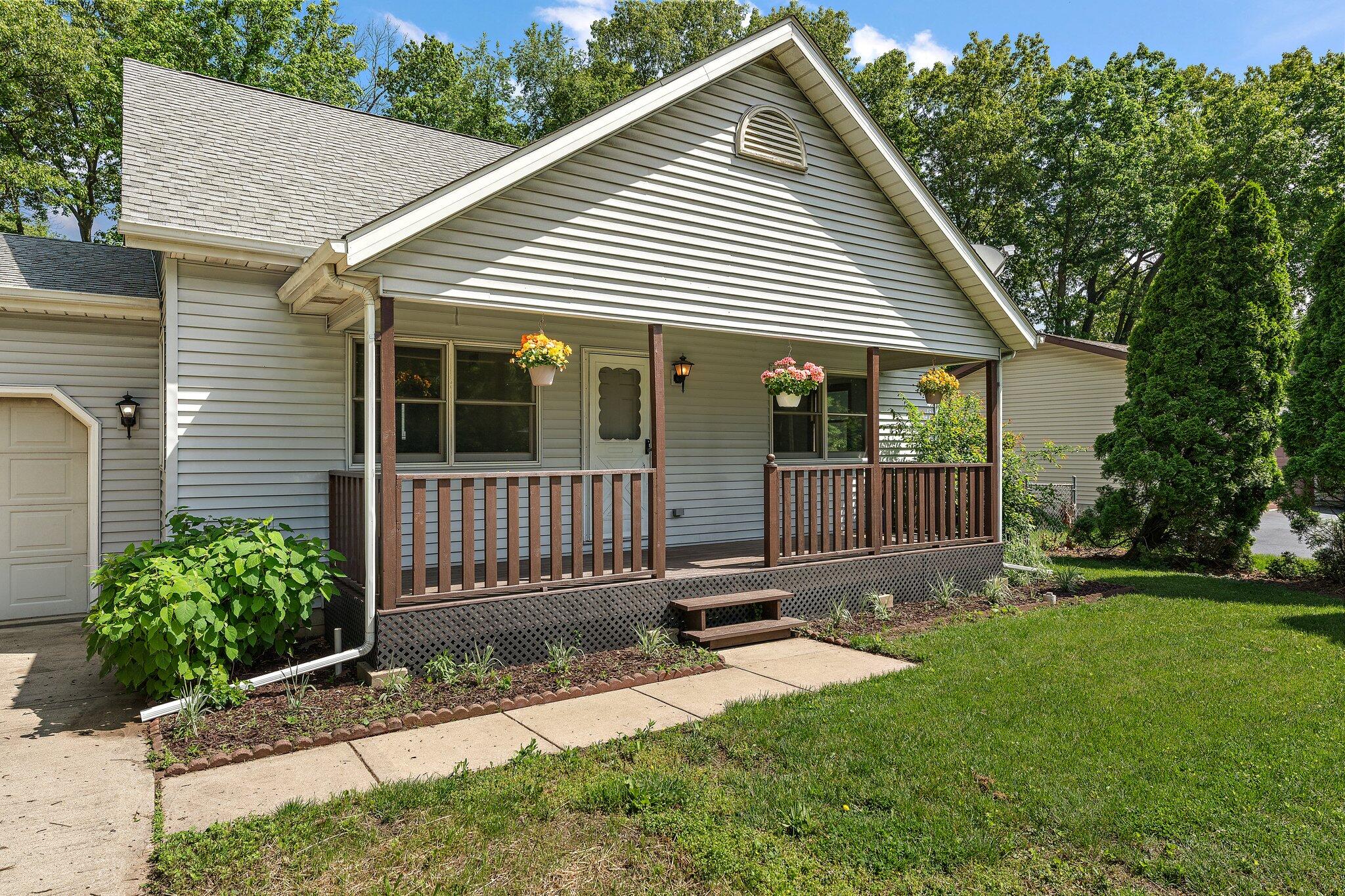 402 Alice Street Kouts, IN 46347 - Photo 4 of 21 a view of a house with a yard and wooden fence