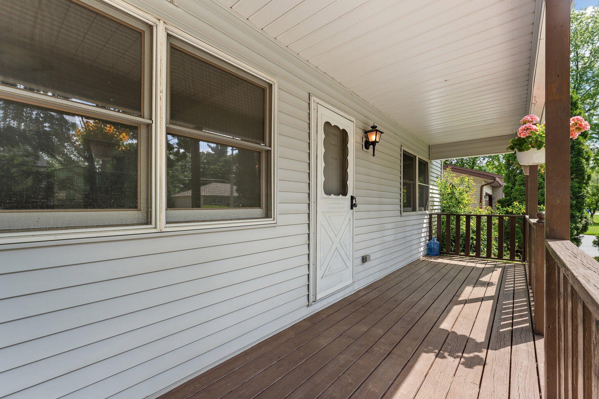 402 Alice Street Kouts, IN 46347 - Photo 5 of 21 a view of a balcony with wooden floor